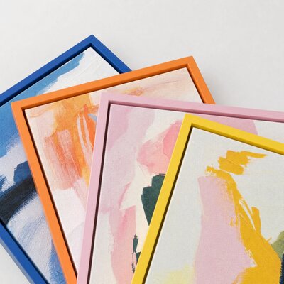Canvas prints in blue, orange, pink and yellow frames